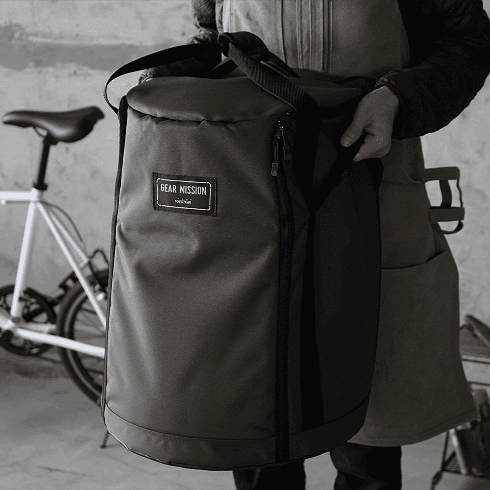 Durable olive green Gear Mission backpack with multiple compartments for cycling gear and essentials.