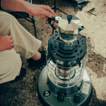 Outdoor portable heater with coffee percolator, ideal for camping, tent heating, and outdoor use.
