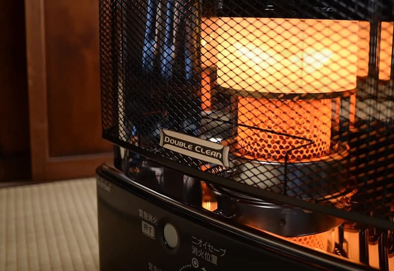 Heater with safety grille and warm light, perfect for indoor residential or commercial heating.