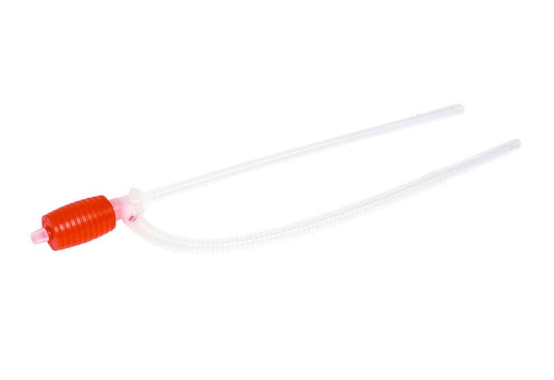 Flexible drain tube with red cap for air conditioning units.